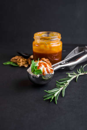 Mushroom Chaga Coffee Superfood Trend-dry and fresh mushrooms and coffee beans on dark background with mint. Ice cream with coffee and caramelの写真素材