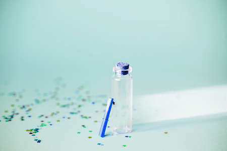 A small glass jar with a scroll for desires, sequins, magic, fulfillment of desires.
