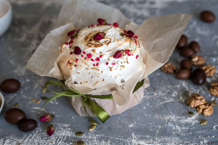 Easter composition with sweet bread, kulich and eggs on light background. Easter holidays breakfast...