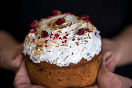Easter composition with sweet bread, kulich and eggs on light background. Easter holidays breakfast...