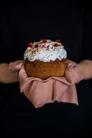 Easter composition with sweet bread, kulich and eggs on light background. Easter holidays breakfast...