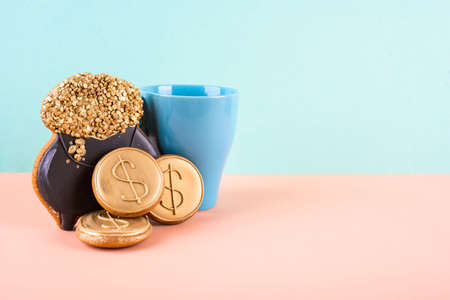 Three gingerbread in the navof of money on an abstract background of different colors.