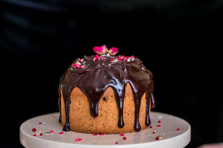 Easter composition with sweet bread, kulich and eggs on light background. Easter holidays breakfast...