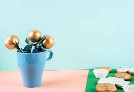 Delicious and beautiful cake pops on an abstract background. Delicious dessert for St. Patrick's Dayの写真素材