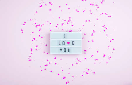 Words i love you on the light box on a light background. Place for text, abstract content....