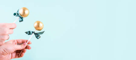 Delicious and beautiful cake pops on an abstract background. Delicious dessert for St. Patrick's Day