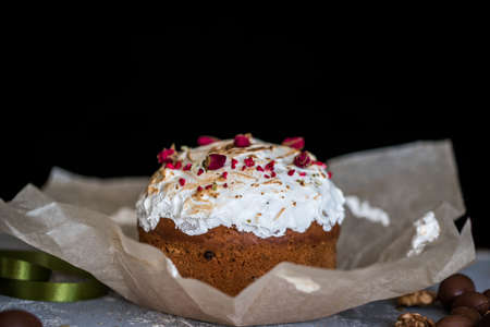 Easter composition with sweet bread, kulich and eggs on light background. Easter holidays breakfast...