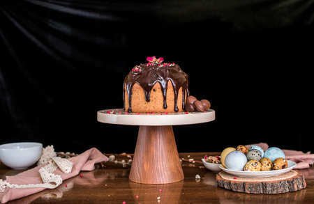 Easter composition with sweet bread, kulich and eggs on light background. Easter holidays breakfast concept.の写真素材