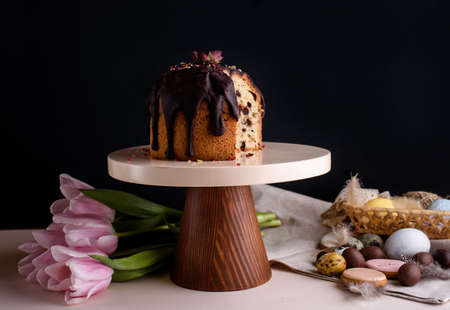 Delicious and very beautiful Easter cake with chocolate and nuts on a beautiful stand. Festive...