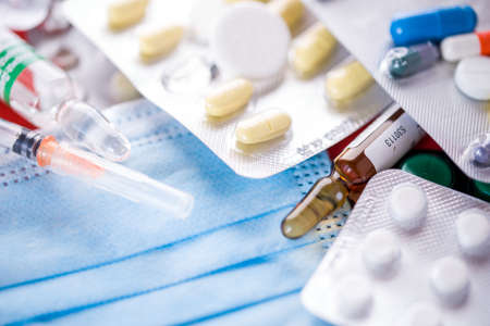 Doctor table with medical items and pills, top view. Medical ampoulesの写真素材