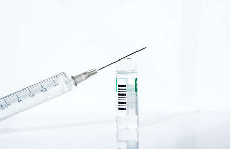 Lots of different pills in torn red paper. Medicines against diseaseの写真素材