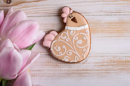 Beautiful Easter composition of eggs with natural colors, gingerbread, flowers, feathers. Holiday content.の写真素材