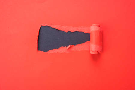 Bright red ragged paper with a place for inscription. The background for the blue tape.