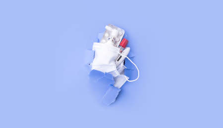 A face mask with anti-virus drugs is washed off the ragged paper. Quarantine. Coronavirus.