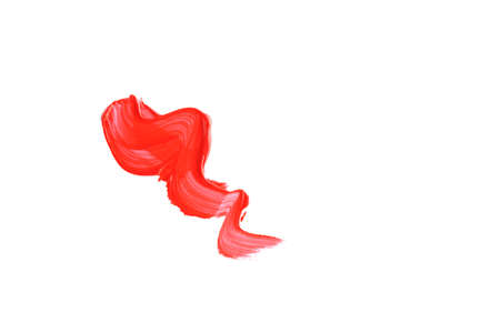A wavy smear of coral paint is insulated on a white background. Creativityの写真素材