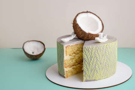 Delicious and beautiful cake with coconut filling on a light background. A place for text. Delicious...