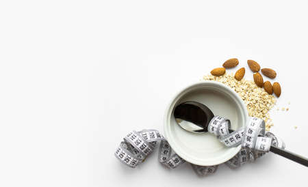 The spoon lies on top of dry oatmeal, and is wrapped in an inch. Healthy breakfast, diet, proper nutritio. Place for textの写真素材