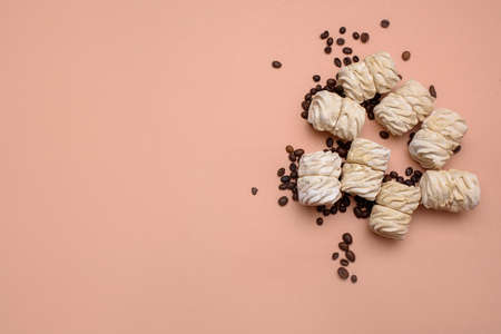 Delicious marshmallow with the taste of coffee, on a light background, with a place for text. Flat...