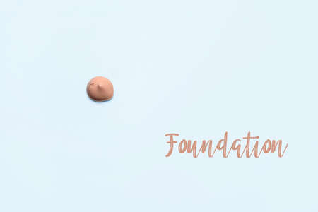 Smears of foundation for face.A smear of lipstick. Cosmetic smear of liquid. Isolated on white backgroundの写真素材