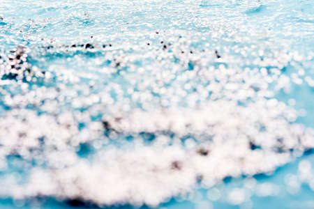 Liquid texture gel with sequins. Brilliant texture on a colored background.Contentの写真素材