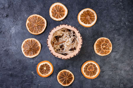 New Years set for mulled wine in a wood box. Fragrant spices, orange peel, cinnamon sticks, badyan.の写真素材