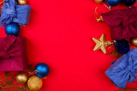 New Years content. Christmas tree toys are golden in color, golden serpentine, side of snow and...