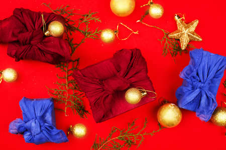 New Years content. Christmas tree toys are golden in color, golden serpentine, side of snow and...