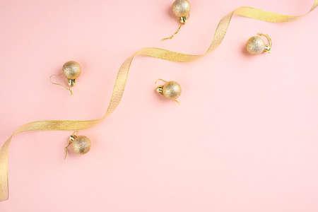 New Years content with sprigs ate, gold toys for the Christmas tree. gift decorated with gold ribbon, the symbol of the new year 2021.の写真素材