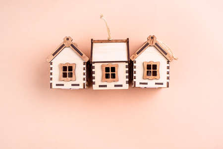 Wooden eco toys on the Christmas tree. In the form of lanterns and houses. New Years content. View from above.の写真素材