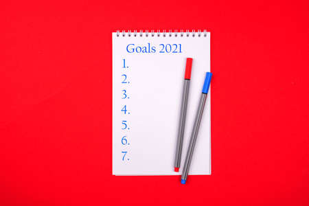 New Year Resolution Goal List 2021 - notebook written in handwriting about plan listing of new year goals and resolutions setting.の写真素材