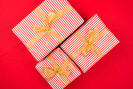 New Years content with sprigs ate, gold toys for the Christmas tree. gift decorated with gold ribbon. Flat layの写真素材