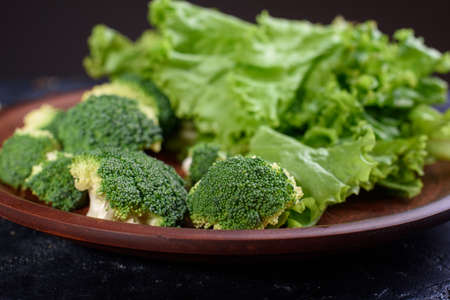 A plate of healthy and delicious food from fresh lettuce, and cabbage. Useful fiber for the body in...