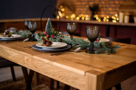 Beautiful winter holiday table for guests, for dinner. Christmas table to celebrate. Holidaysの写真素材