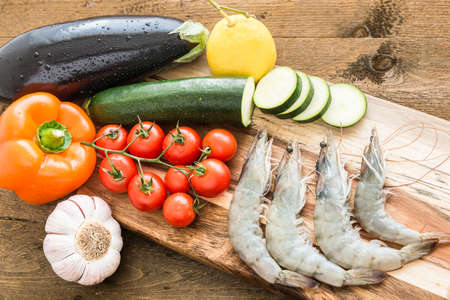 Fresh shrimps with fresh vegetables for cooking.の写真素材