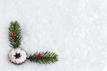 Snow background with christmas cookie and decoration.の写真素材