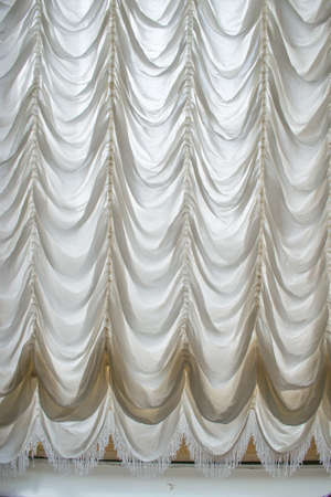 Elegant white interior curtain in front of a windowのeditorial素材