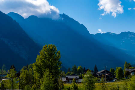 Sun rays on mountains peaks and valley at sun set time in Val D'Ayas in northern Italy near Mont...