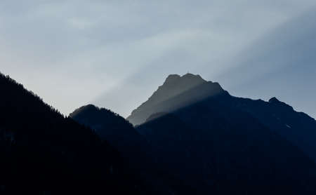 Sun rays on mountains peaks and valley at sun set time in Val D'Ayas in northern Italy near Mont...