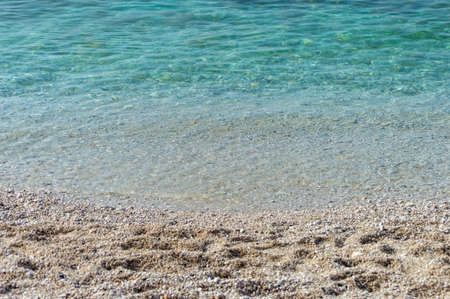 Capobianco beach in Elba Island, Italy. White pebbles and cristal clear turquoise waterの写真素材