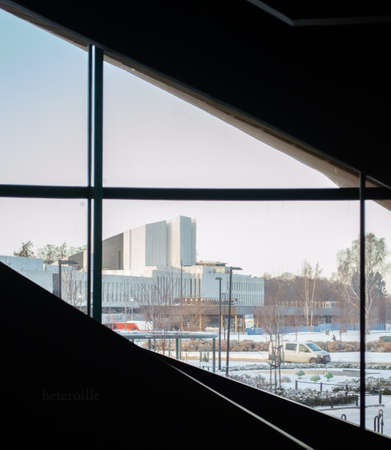Helsinki, Finland, December 2021. Interior detail of Oodi central library. From the window and through the spiral staircase you can see Finlandia Hallのeditorial素材