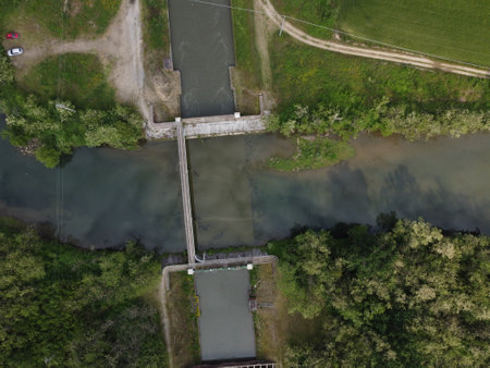 Top-down drone view of Canale Cavour in Novara, showcasing canal intersections in Piedmont's vast irrigation systemの写真素材