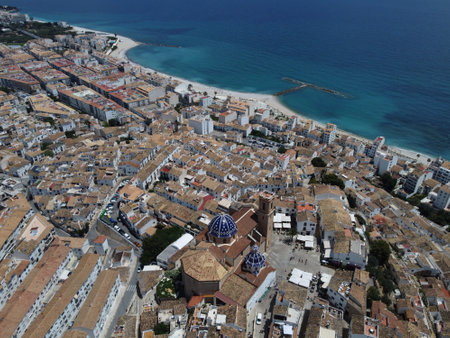 Drone view of Altea from above, highlighting whitewashed houses, coastal charm, and the serene Mediterranean Sea along the Costa Blanca.の写真素材