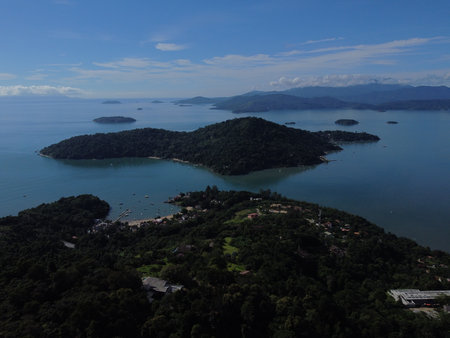 Drone view of Paraty, Rio de Janeiro, showcases lush Atlantic Forest, vibrant coastlines, and many small islands in the sparkling sea.の写真素材