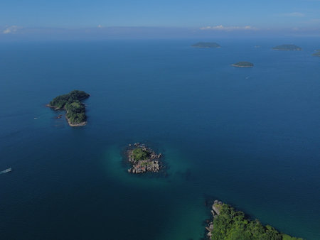 A stunning drone view of Paraty Bay with Ilha dos Cocos, crystal-clear waters, lush islands, and...