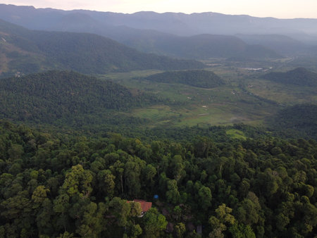 Sunset drone video over Paraty, Brazil, reveals lush Atlantic Forest, golden skies, and small islands scattered along the glowing coastline.の写真素材