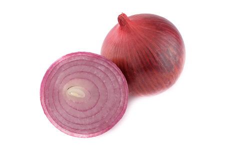 Whole fresh unpeeled red onion and half isolated on white backgroundの写真素材