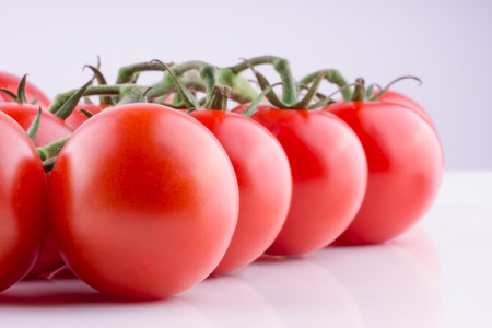 Beautiful ripe tomatoes on white background. Ingredient for many dishes, sauces, salads and drinks.の写真素材
