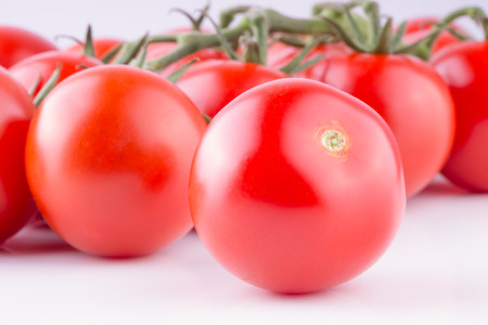Beautiful ripe tomatoes on white background. Ingredient for many dishes, sauces, salads and drinks.の写真素材