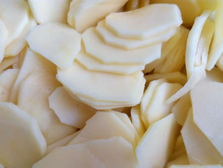 Raw shelled sliced ??potatoes closeupの写真素材