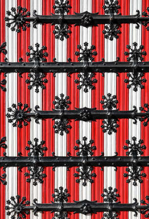 Medieval castle gate with iron fittings.
Wooden door with iron fittings.の写真素材